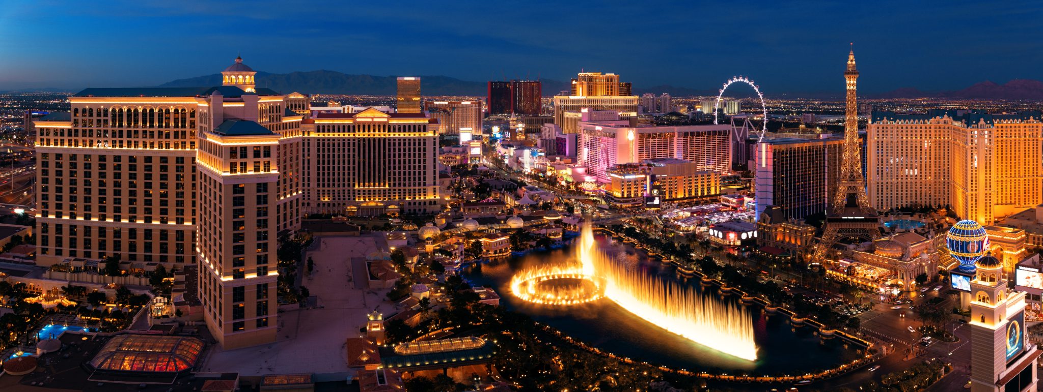 Las Vegas Strip at night with illuminated hotels, casinos, and Bellagio fountains